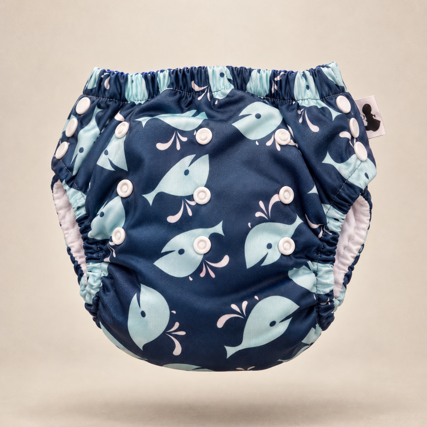 Whales swim nappy print