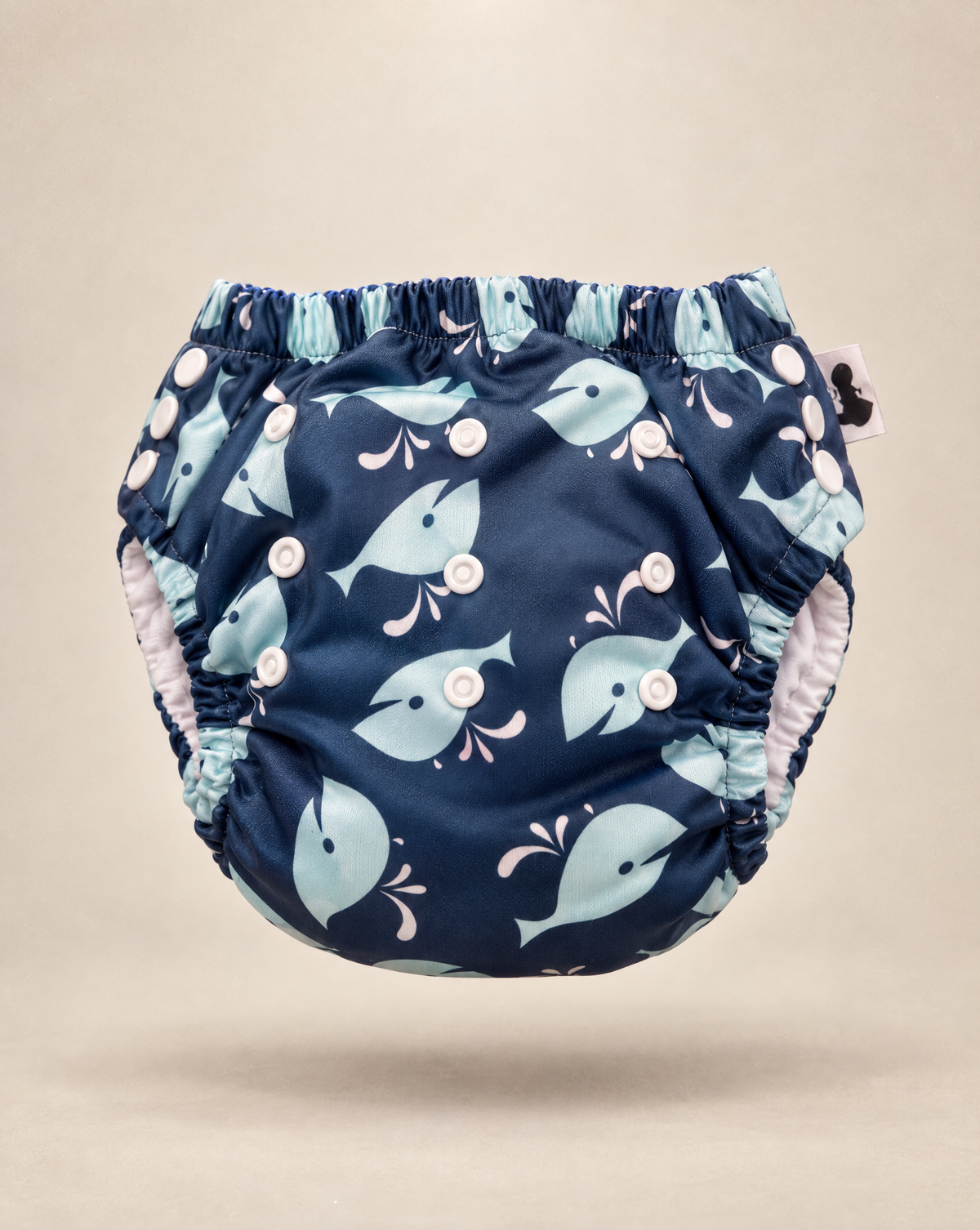 Whales swim nappy print